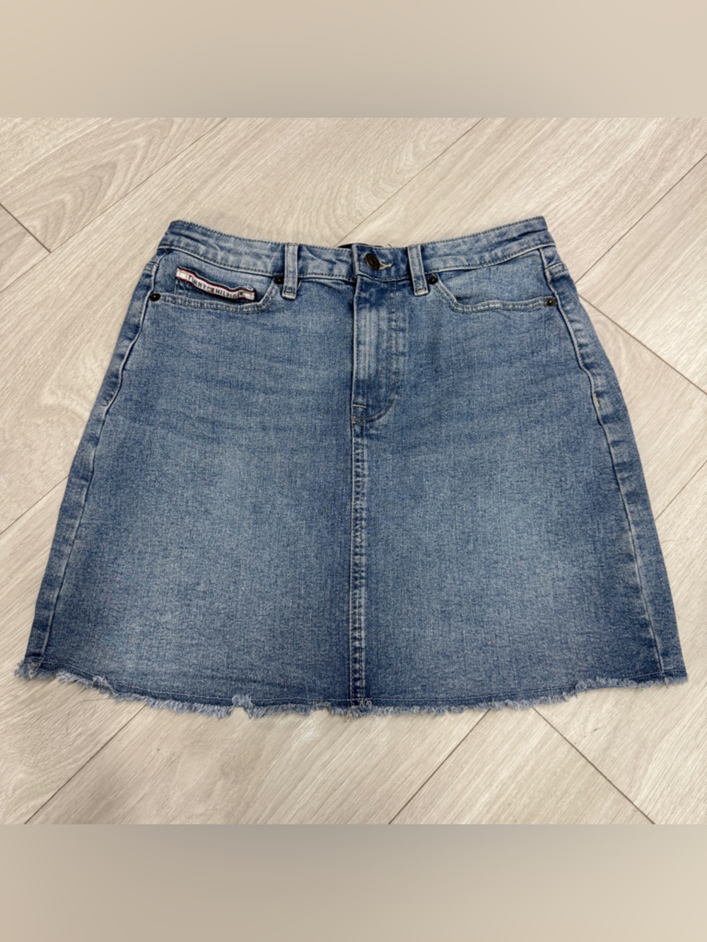 Tommy Hilfiger: A-Line Denim Mini Skirt in Light Blue with Raw Hem, size 4